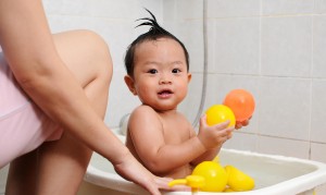 Baby in Bath with Colored Balls