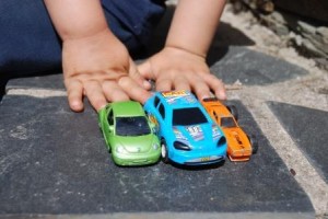Toddler Hands with Toy Cars