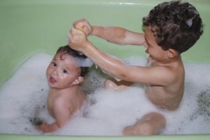 Young brothers in bubble bath together